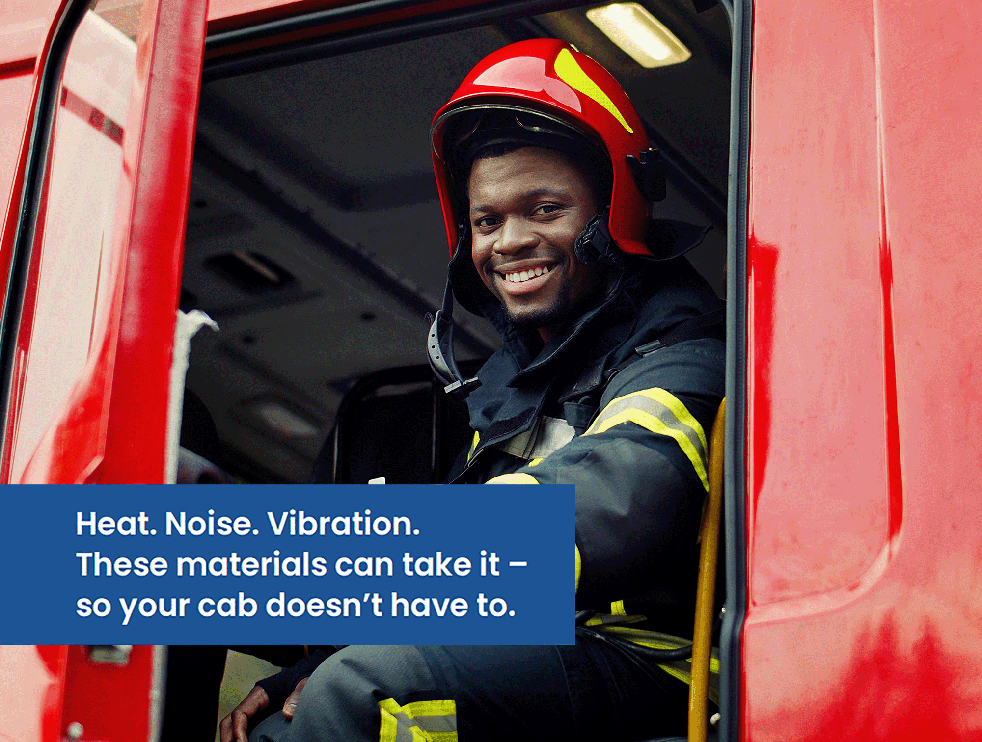 Happy firefighter seated in emergency vehicle